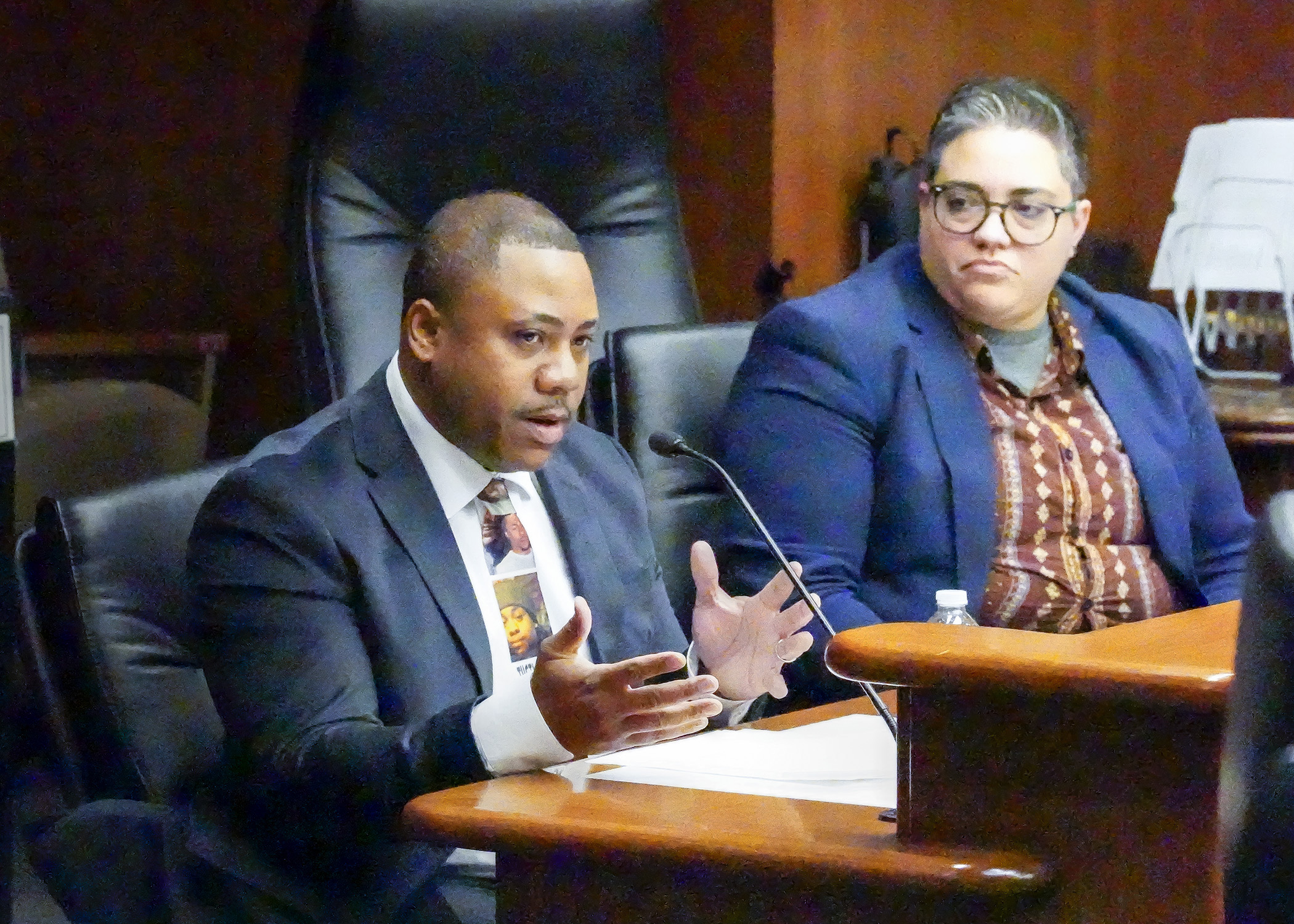 Andre Locke testifies before House lawmakers in support of a bill sponsored by Rep. Brion Curran, right, to prohibit no-knock search warrants. His son, Amir, was killed by Minneapolis Police executing such a warrant. (Photo by Andrew VonBank)